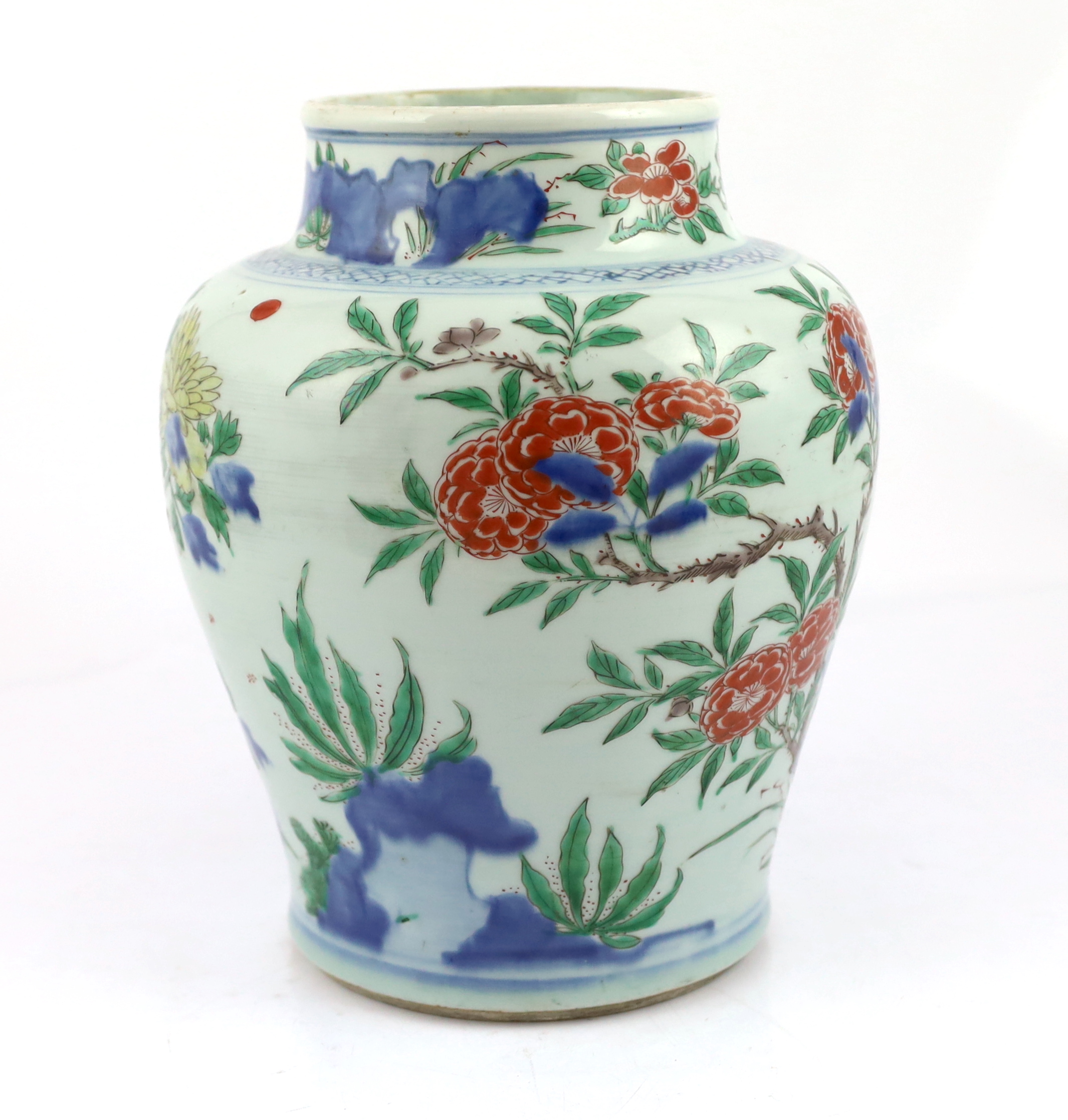 A Chinese wucai ‘rocks and blossom’ vase, Transitional, Shunzhi period, cracked and restoration to neck